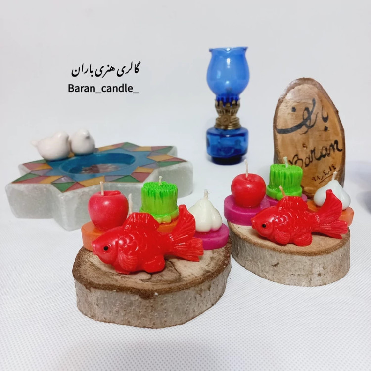 شمع دست ساز هفت سین (سبزه،سیر،سیب و ماهی) با کفه ی تنه ی درخت مناسب عیدی و هدیه