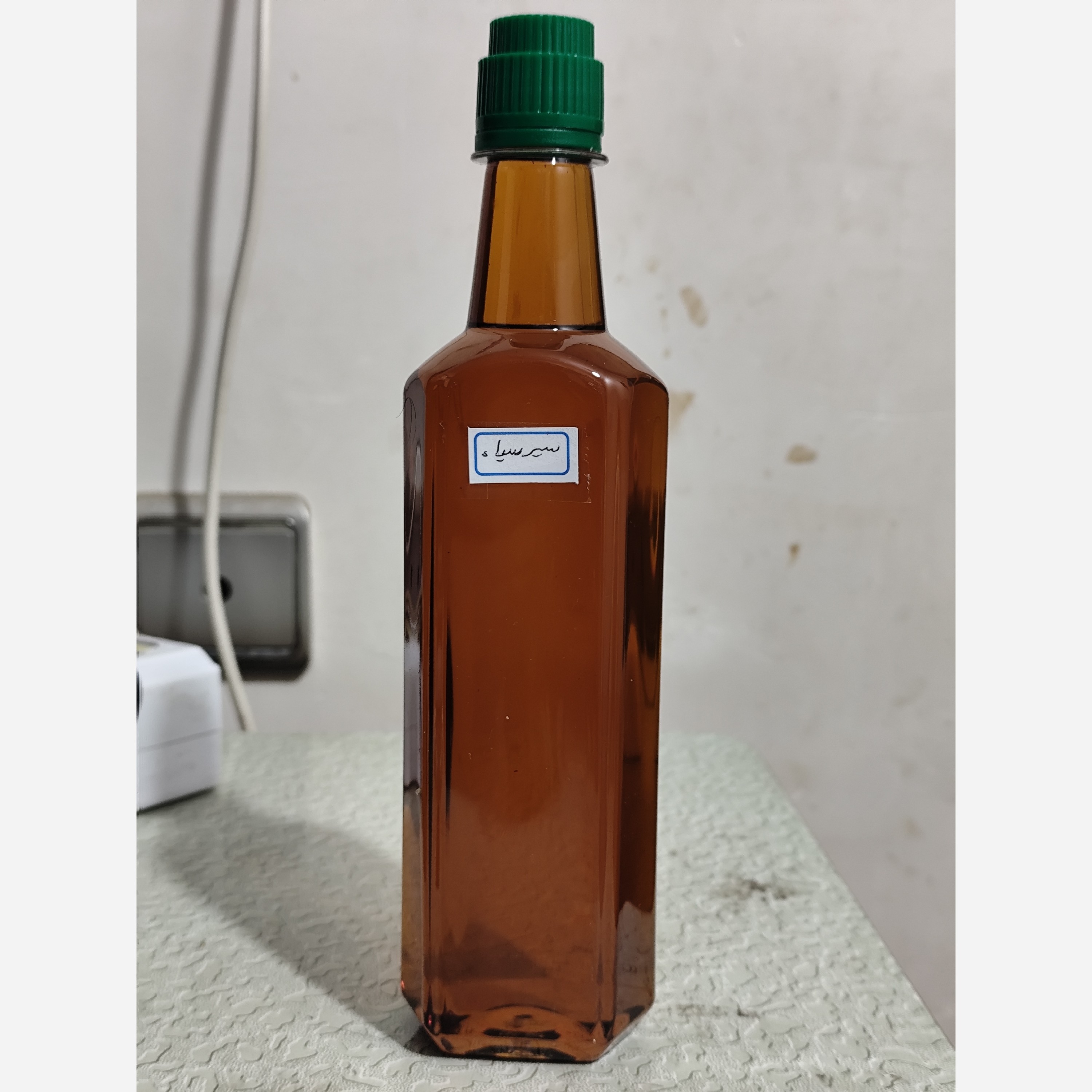 روغن سیر سیاه اصل و خالص نیم لیتری (پرپشت کننده مو پرپشت کننده ابرو تقویت مژه تقویت ریش و سبیل ) سیرسیاه