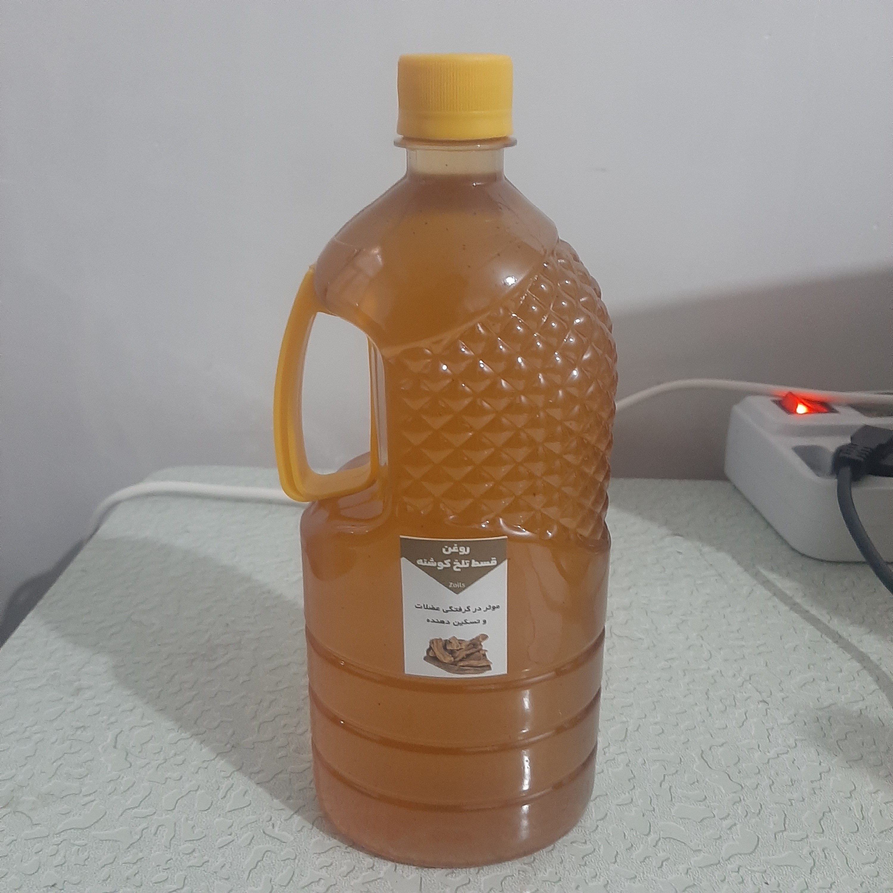 روغن قسط تلخ قسط هندی یک لیتری اصل و خالص تلخ (موثر در گرفتگی عضلات و تسکین دهنده) روغن کوشنه