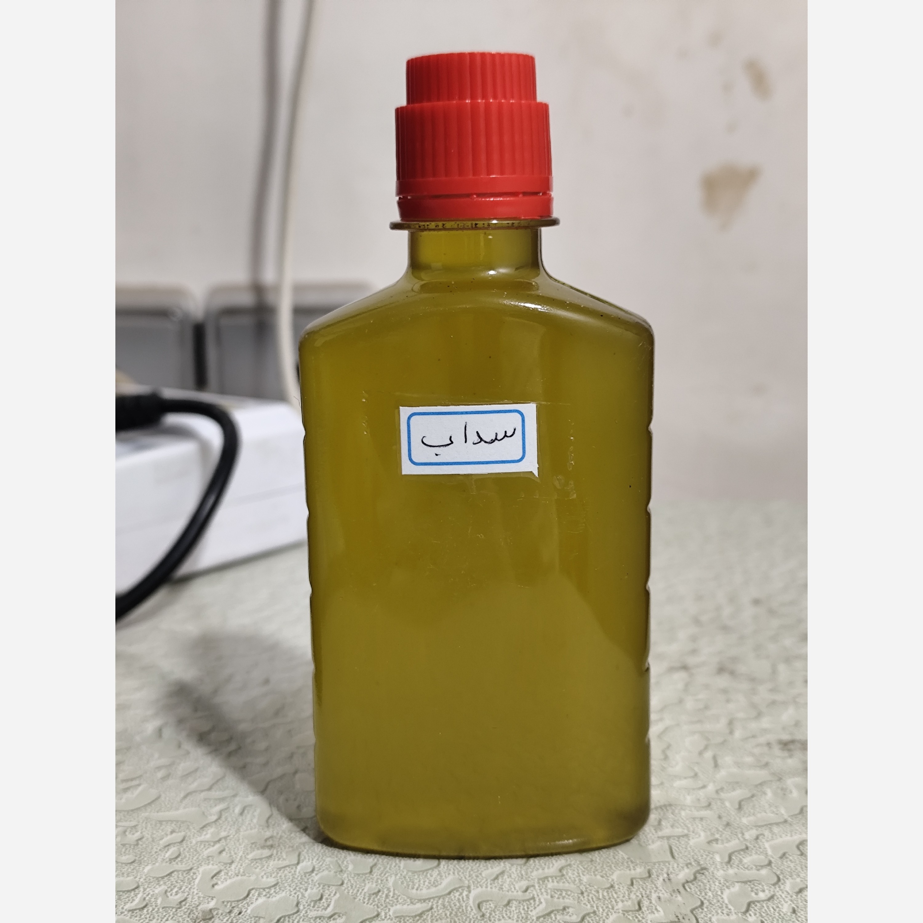 روغن سداب ربع لیتری اصل (دردگوش صدای گوش وزوز گوش گوش درد شستشوی گوش تقویت شنوایی) روغن فیجن